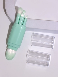 Detailed view of the 5-in-1 mint green makeup brush set with various bristles and clear caps