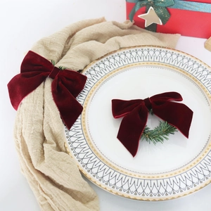 Velvet Christmas bow napkin rings in wine red for festive dining table decoration