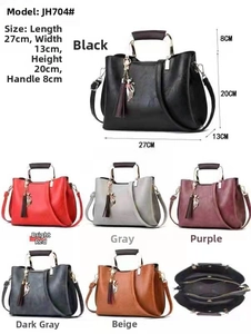 Multi-color handbag collection showing interior structure and gold cat charm detail