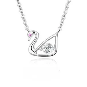 Macro view of S925 sterling silver swan pendant with sparkling pink and white cubic zirconia