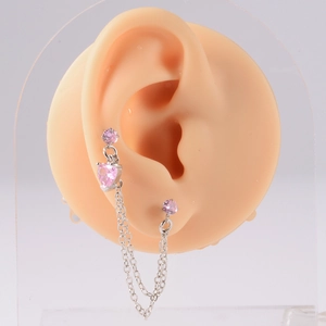 Detail of pink heart zircon earring featuring a silver double chain tassel pendant