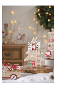 Close-up of decorative wooden Christmas house ornament with Merry Xmas text and Santa details