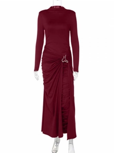 Close-up of elegant burgundy maxi dress featuring waist ruching and wavy silver metal buckle