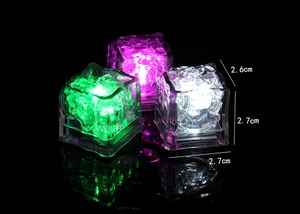 Three glowing LED ice cubes in pink, green, and white showing 2.6cm by 2.7cm size details