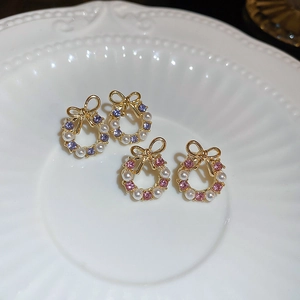 Elegant bow and faux pearl wreath earrings with pink and purple rhinestones