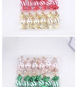 Close-up of assorted candy-shaped Christmas tree ornaments with colorful stripes and dots