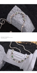 Detail of S925 silver retro bracelet with colorful zircons and engraved metal beads