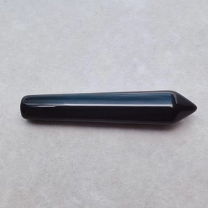 Polished natural black obsidian hexagonal crystal point for energy healing and massage