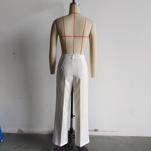 Detail view of the back of white high-waisted wide-leg trousers for women on a mannequin