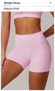 Detail of high waisted yoga shorts in cherry blossom pink with side pockets