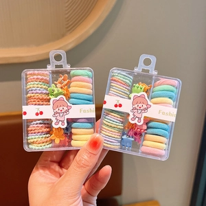Detail of colorful macaron hair accessories set in a clear plastic storage box