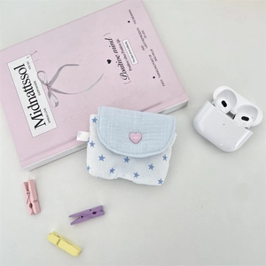 Knitted wireless earphone case featuring light blue heart button and star pattern