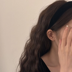 Classic black velvet wide headband shown on a model for a vintage French aesthetic look