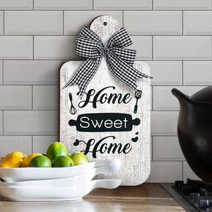 Macro detail of Home Sweet Home wooden cutting board sign with bow and lemon decor