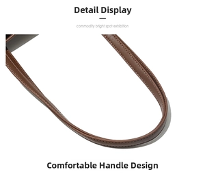 Detailed close-up of brown leather bag handle with precise stitching and oil-edge finish