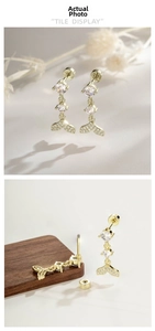 Detail of coffee gold mermaid tail earrings with crystal studs and screw back