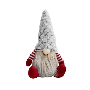Christmas plush gnome ornament with grey knitted body and red pointed hat on white background