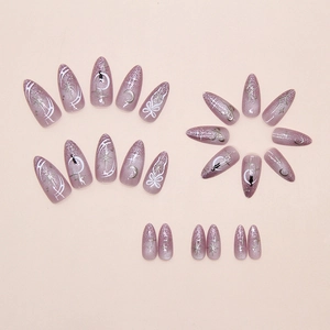 Detail of purple cat eye press on nails with moon, stars, and black cat silhouette