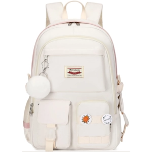 Close-up of off-white backpack with plush pendant, multiple pockets and cute badges