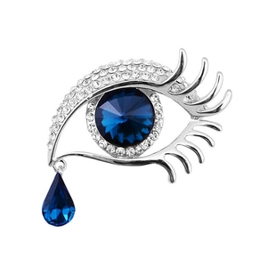 Silver eye brooch with blue crystal teardrop and sparkling rhinestone accents