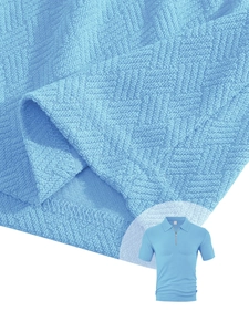 Detailed macro view of sky blue waffle knit fabric and high-quality hem stitching on polo shirt