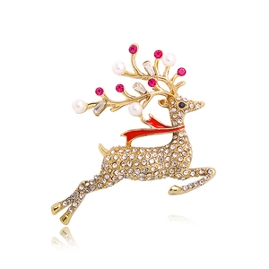 Christmas reindeer brooch with white crystals, pearls and red enamel scarf on white background