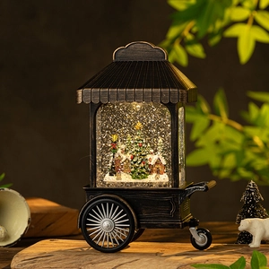 Vintage bronze Christmas cart snow globe with LED lights and festive winter scene