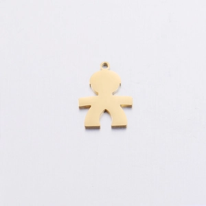 Macro shot of polished gold boy-shaped stainless steel pendant on white textured background