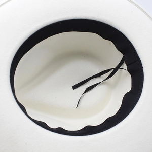 Detail view of the interior sweatband and adjustable drawstring of this off-white fedora hat
