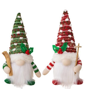 Christmas glowing faceless gnomes with ski boards for holiday tabletop decoration