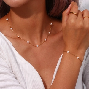 Elegant gold stainless steel necklace and bracelet set with white freshwater pearls