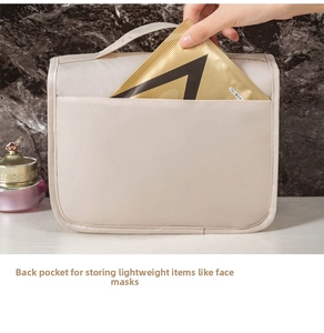 Close-up of beige hanging toiletry bag back pocket for storing facial masks