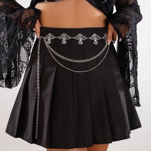 Punk style mushroom waist chain with silver crescent moon pendants on a black skirt