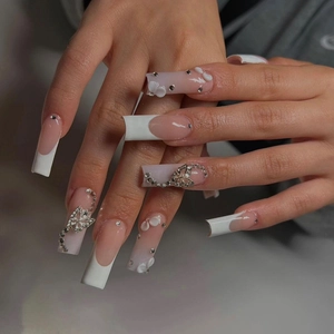 French long square press-on nails with silver bows, white flowers and rhinestones