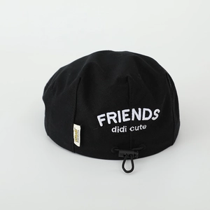 Detail of black cotton beret with white Friends embroidery and adjustable drawstring