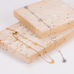 Gold and silver heart chain anklets with LOVE engraving and small diamond accents
