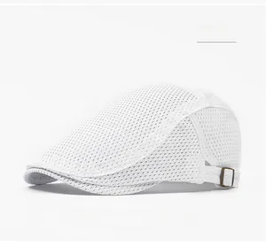 Side detail of white mesh flat cap showing breathable fabric and bronze metal buckle