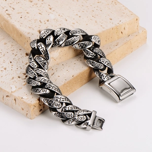 Vintage stainless steel Cuban link bracelet with engraved totems and oxidized finish