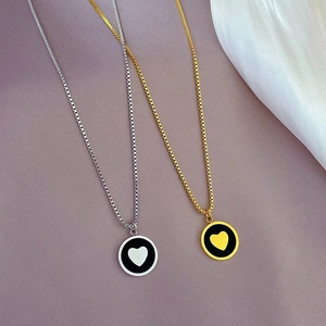 Minimalist heart pendant necklace in gold and silver finish with box chain on satin