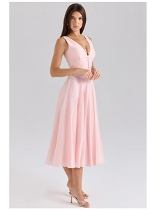 Detail of pink sleeveless maxi dress featuring a V-neckline and decorative front buttons