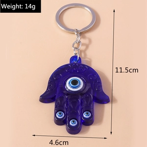 Blue resin Evil Eye Hamsa keychain with size dimensions 11.5cm by 4.6cm and weight 14g