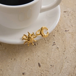 Adjustable gold celestial ring set featuring sun relief and crescent moon designs