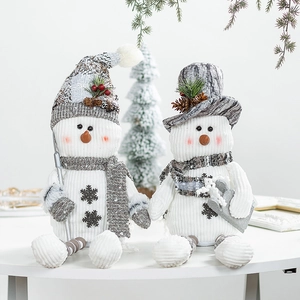 Set of two Nordic snowman figurines with corduroy texture and knit hats for Christmas decor