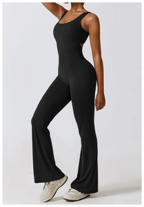 Side view of backless black yoga jumpsuit with high-waisted flared leg design