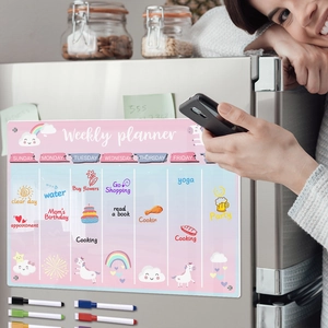 Magnetic acrylic weekly planner on fridge with colorful markers and cartoon patterns