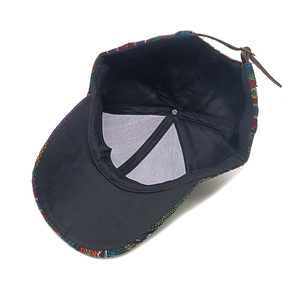 Bohemian style woven baseball cap with colorful ethnic patterns and adjustable leather strap
