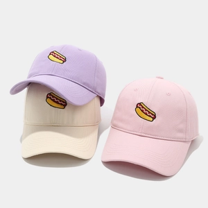 Detailed embroidery of hot dog pattern on cotton twill baseball caps in pastel colors