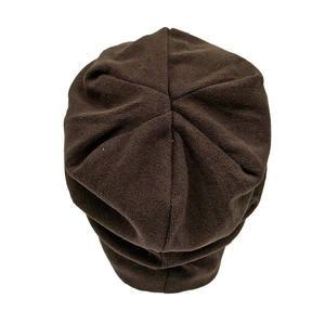 Top view of dark brown knitted beanie showing detailed six-segment crown structure