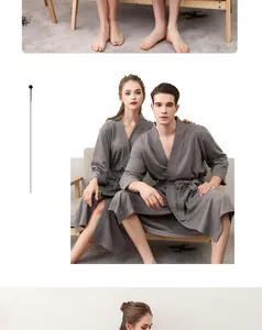 Detailed view of grey waffle weave fabric on a breathable couple's bathrobe set
