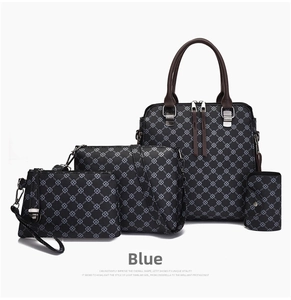 Detailed close-up of a 4-piece printed handbag set featuring blue geometric chain patterns